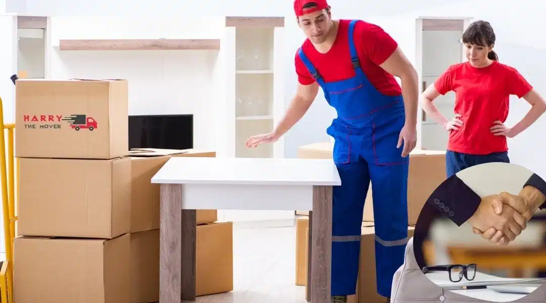 Moving team of Harry the Mover arranging furniture in a client's new home, demonstrating professional moving services.